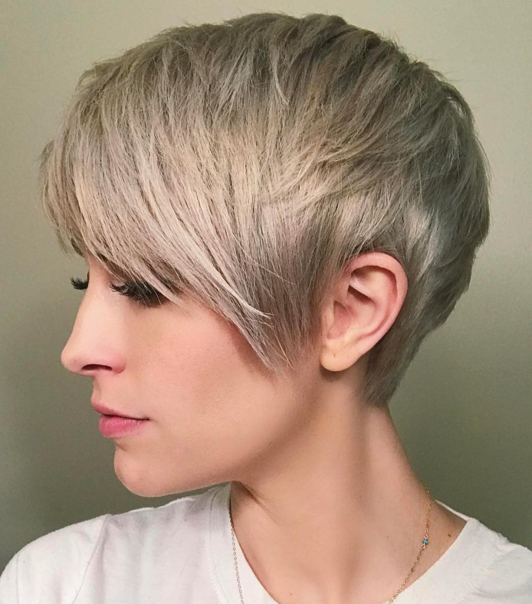 Textured mid-ash-blonde short straight hairstyle